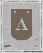 A taped needlepoint canvas with the design: Banner 18 mesh count Curved A White on Brown.