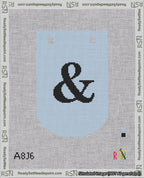 A taped needlepoint canvas with the design: Banner 18 mesh count Curved Ampersand Black on Light Blue.