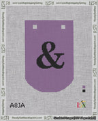 A taped needlepoint canvas with the design: Banner 18 mesh count Curved Ampersand Black on Purple.