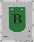 A taped needlepoint canvas with the design: Banner 18 mesh count Curved B Black on Green.
