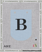 A taped needlepoint canvas with the design: Banner 18 mesh count Curved B Black on Light Blue.