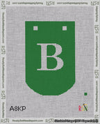 A taped needlepoint canvas with the design: Banner 18 mesh count Curved B White on Green.