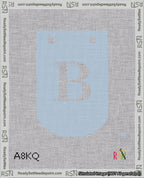 A taped needlepoint canvas with the design: Banner 18 mesh count Curved B White on Light Blue.