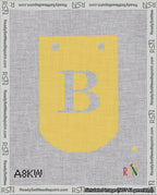 A taped needlepoint canvas with the design: Banner 18 mesh count Curved B White on Yellow.