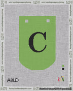 A taped needlepoint canvas with the design: Banner 18 mesh count Curved C Black on Light Green.