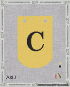 A taped needlepoint canvas with the design: Banner 18 mesh count Curved C Black on Yellow.