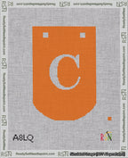 A taped needlepoint canvas with the design: Banner 18 mesh count Curved C White on Orange.