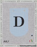 A taped needlepoint canvas with the design: Banner 18 mesh count Curved D Black on Light Blue.