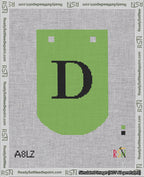 A taped needlepoint canvas with the design: Banner 18 mesh count Curved D Black on Light Green.