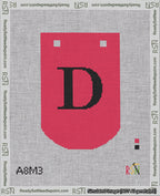 A taped needlepoint canvas with the design: Banner 18 mesh count Curved D Black on Red.