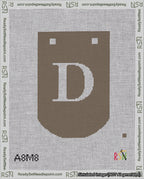 A taped needlepoint canvas with the design: Banner 18 mesh count Curved D White on Brown.