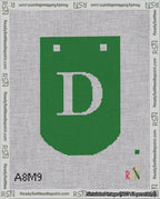 A taped needlepoint canvas with the design: Banner 18 mesh count Curved D White on Green.