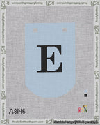 A taped needlepoint canvas with the design: Banner 18 mesh count Curved E Black on Light Blue.