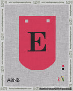 A taped needlepoint canvas with the design: Banner 18 mesh count Curved E Black on Red.