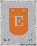 A taped needlepoint canvas with the design: Banner 18 mesh count Curved E White on Orange.