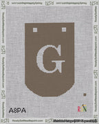 A taped needlepoint canvas with the design: Banner 18 mesh count Curved G White on Brown.