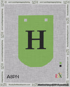 A taped needlepoint canvas with the design: Banner 18 mesh count Curved H Black on Light Green.