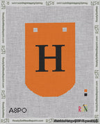 A taped needlepoint canvas with the design: Banner 18 mesh count Curved H Black on Orange.