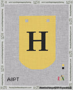 A taped needlepoint canvas with the design: Banner 18 mesh count Curved H Black on Yellow.