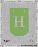 A taped needlepoint canvas with the design: Banner 18 mesh count Curved H White on Light Green.