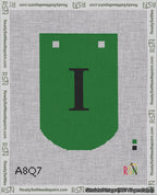 A taped needlepoint canvas with the design: Banner 18 mesh count Curved I Black on Green.