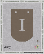 A taped needlepoint canvas with the design: Banner 18 mesh count Curved I White on Brown.