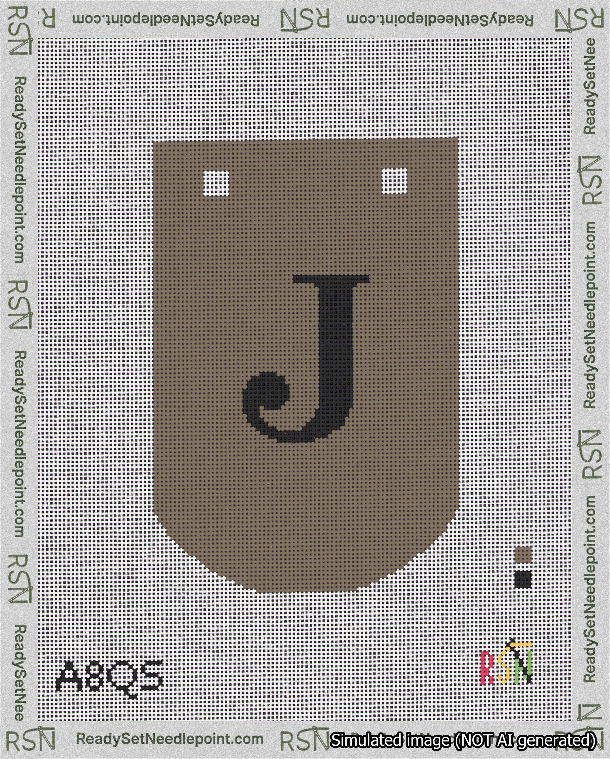A taped needlepoint canvas with the design: Banner 18 mesh count Curved J Black on Brown.