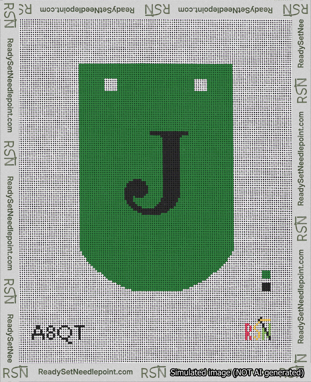 A taped needlepoint canvas with the design: Banner 18 mesh count Curved J Black on Green.