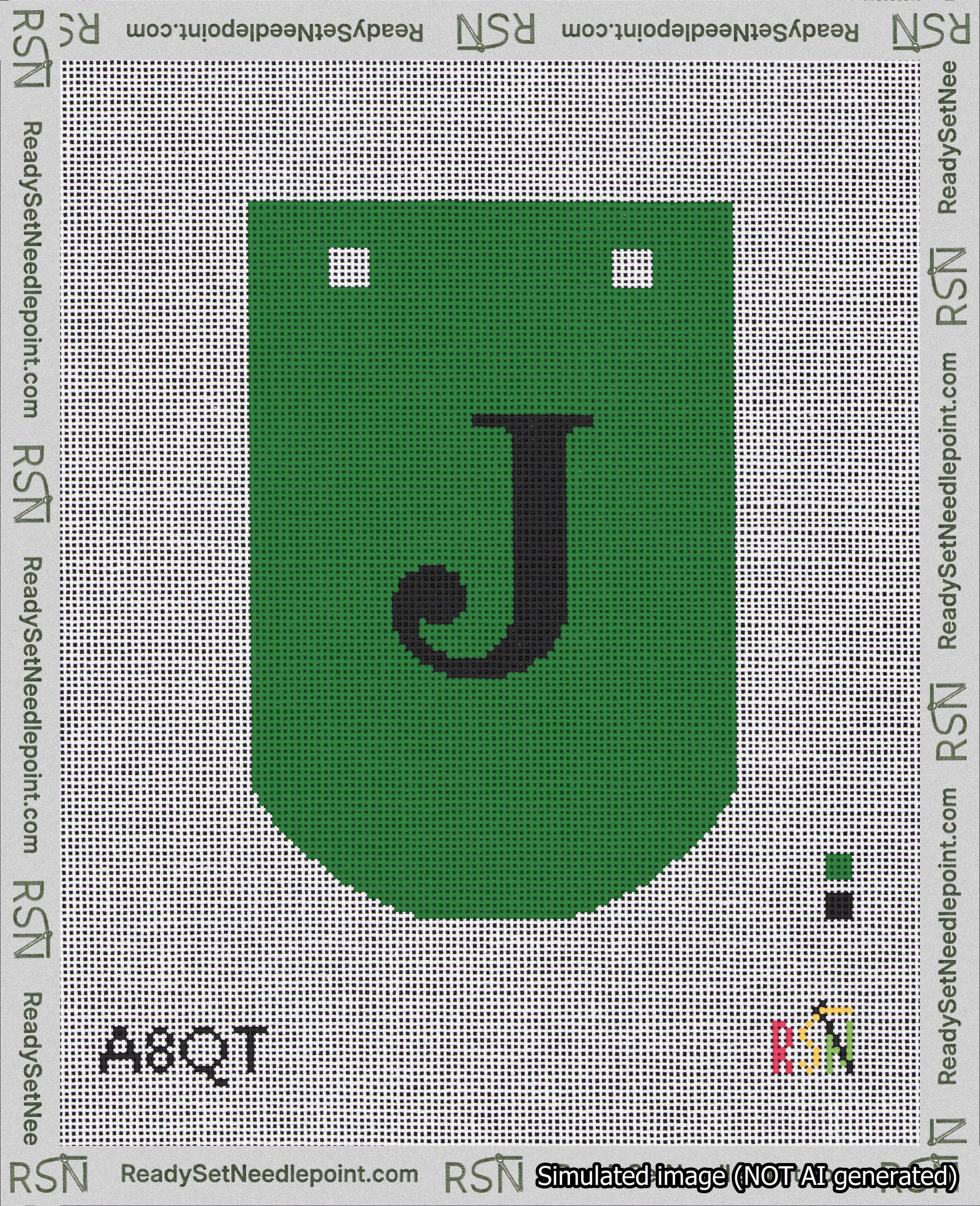 A taped needlepoint canvas with the design: Banner 18 mesh count Curved J Black on Green.