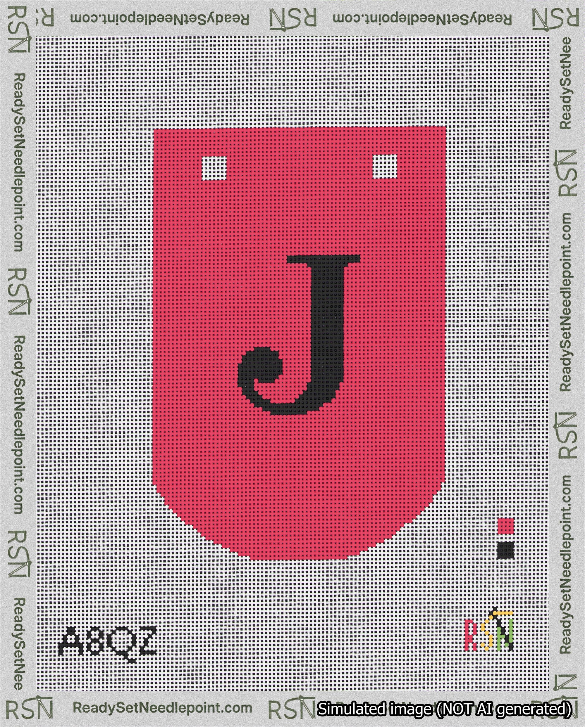 A taped needlepoint canvas with the design: Banner 18 mesh count Curved J Black on Red.