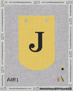 A taped needlepoint canvas with the design: Banner 18 mesh count Curved J Black on Yellow.