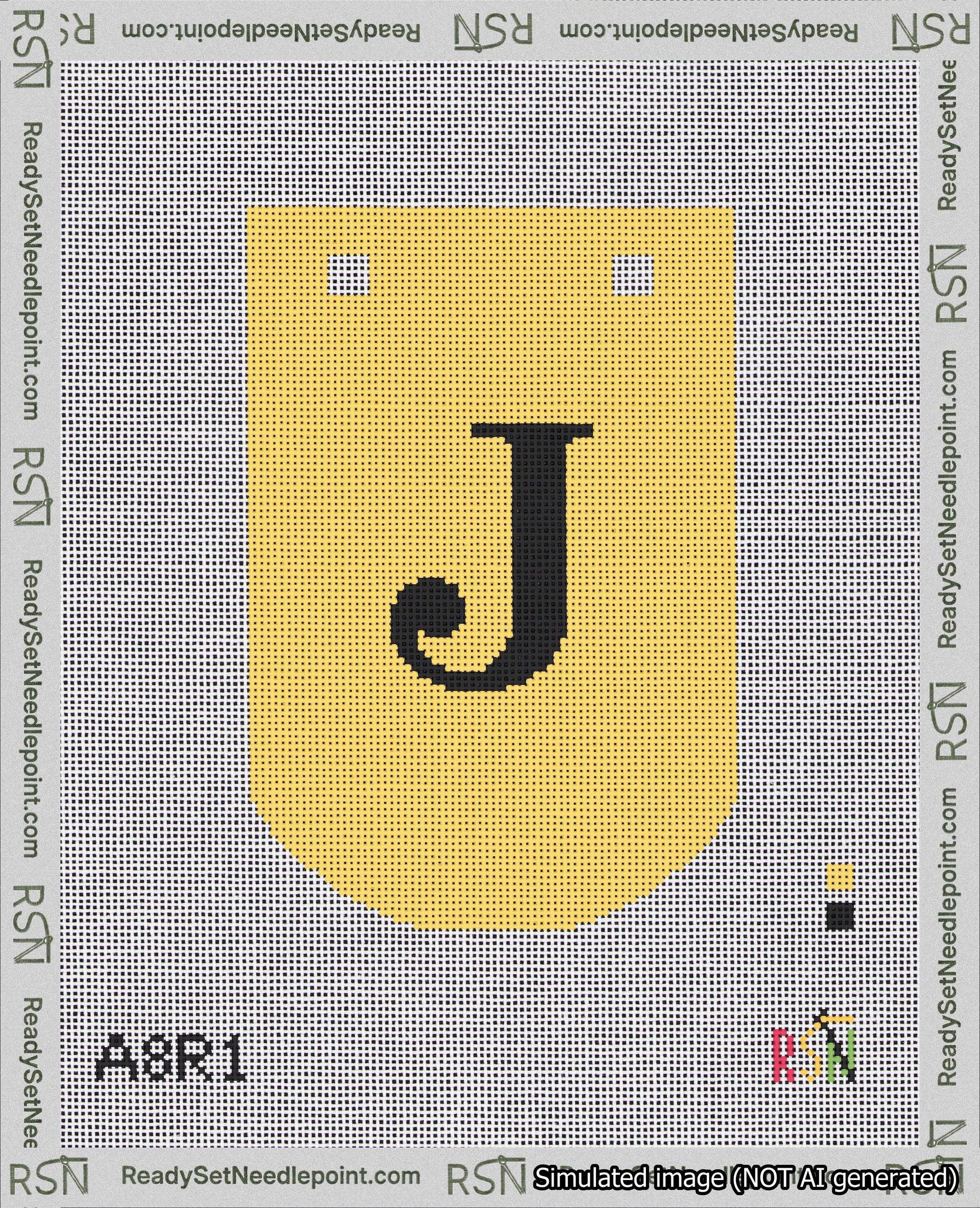 A taped needlepoint canvas with the design: Banner 18 mesh count Curved J Black on Yellow.