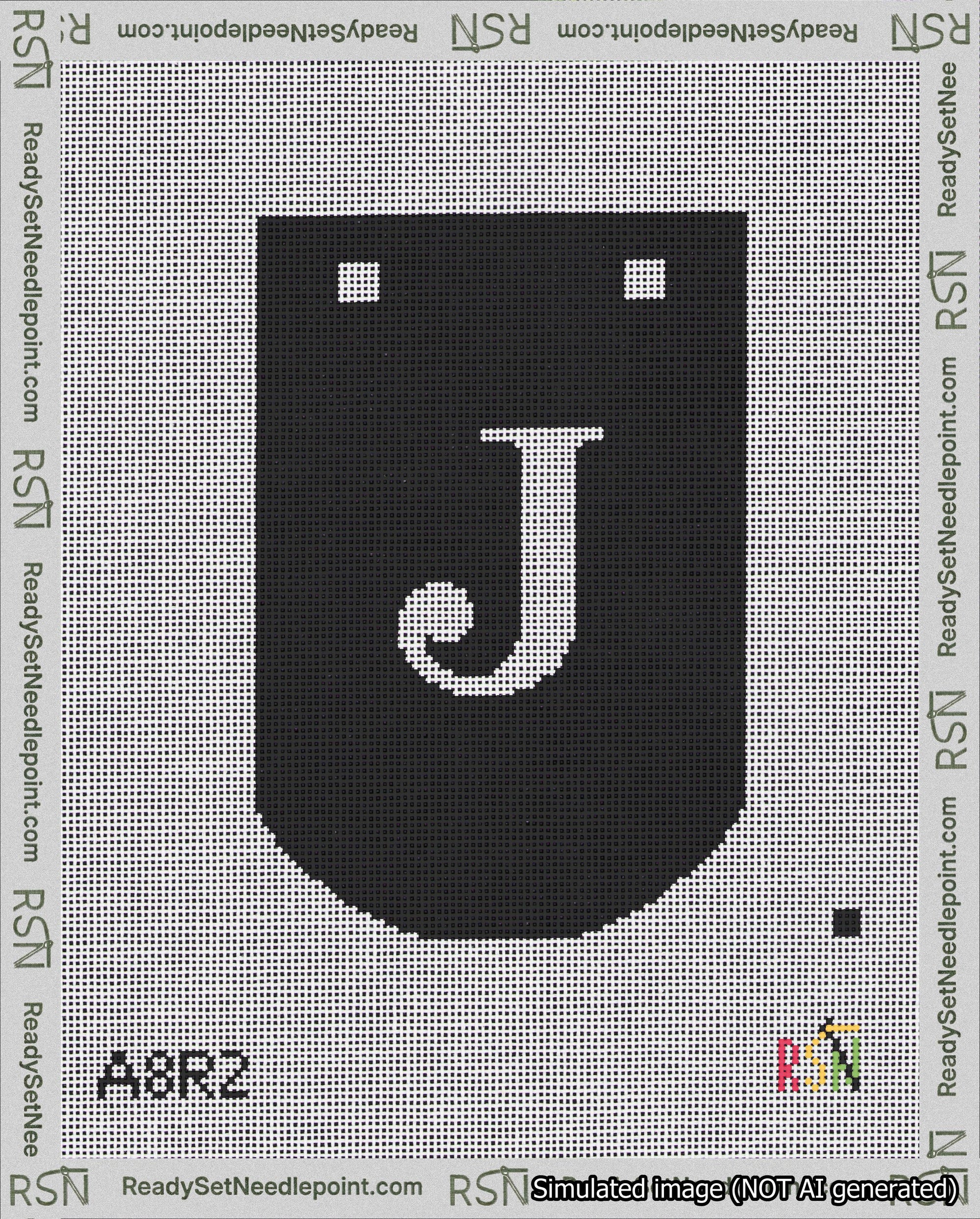A taped needlepoint canvas with the design: Banner 18 mesh count Curved J White on Black.