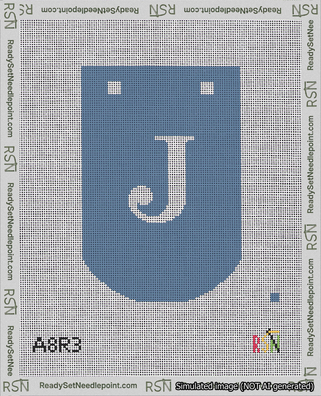 A taped needlepoint canvas with the design: Banner 18 mesh count Curved J White on Blue.