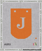 A taped needlepoint canvas with the design: Banner 18 mesh count Curved J White on Orange.