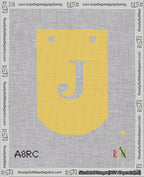 A taped needlepoint canvas with the design: Banner 18 mesh count Curved J White on Yellow.