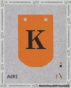 A taped needlepoint canvas with the design: Banner 18 mesh count Curved K Black on Orange.