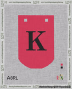 A taped needlepoint canvas with the design: Banner 18 mesh count Curved K Black on Red.