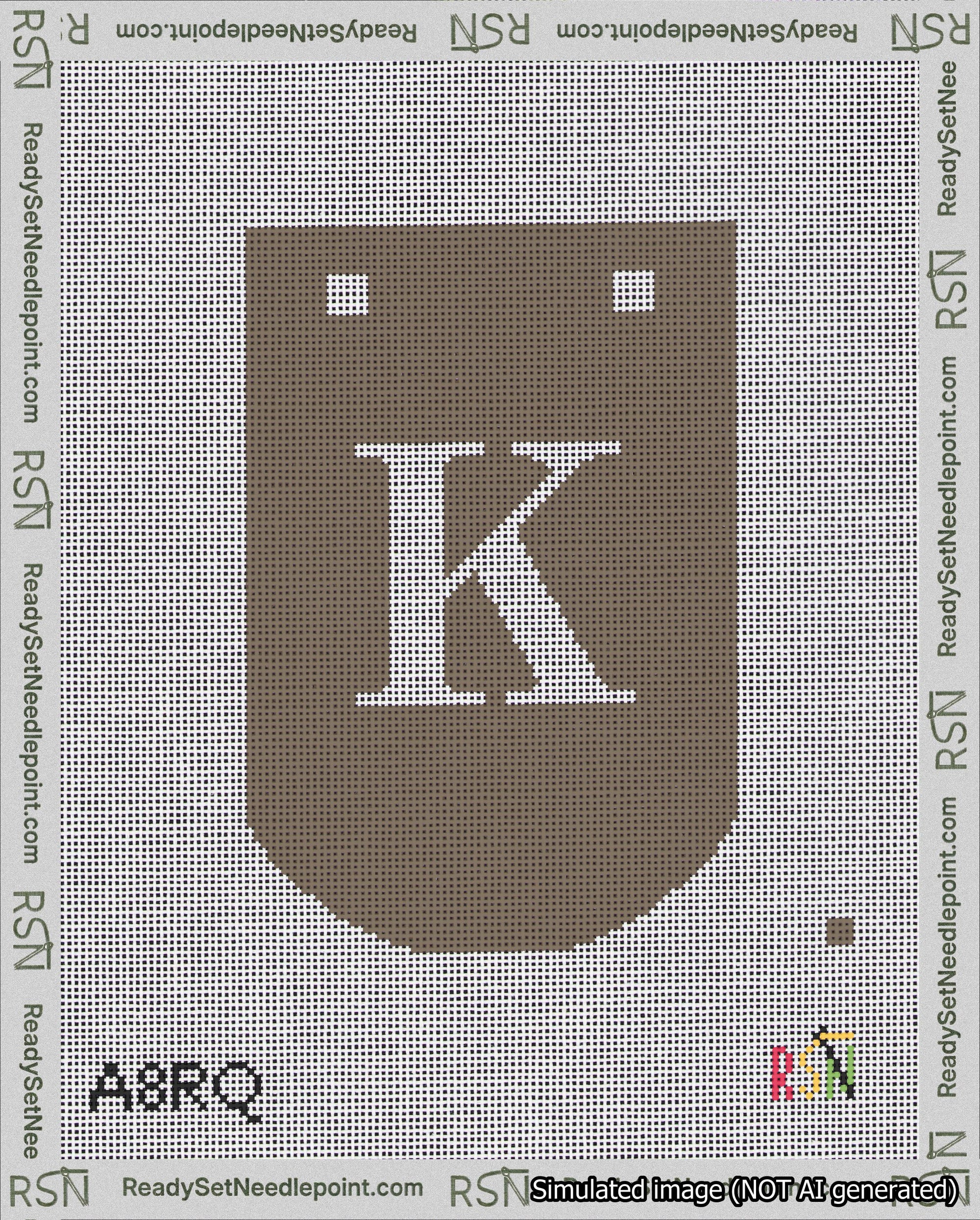 A taped needlepoint canvas with the design: Banner 18 mesh count Curved K White on Brown.
