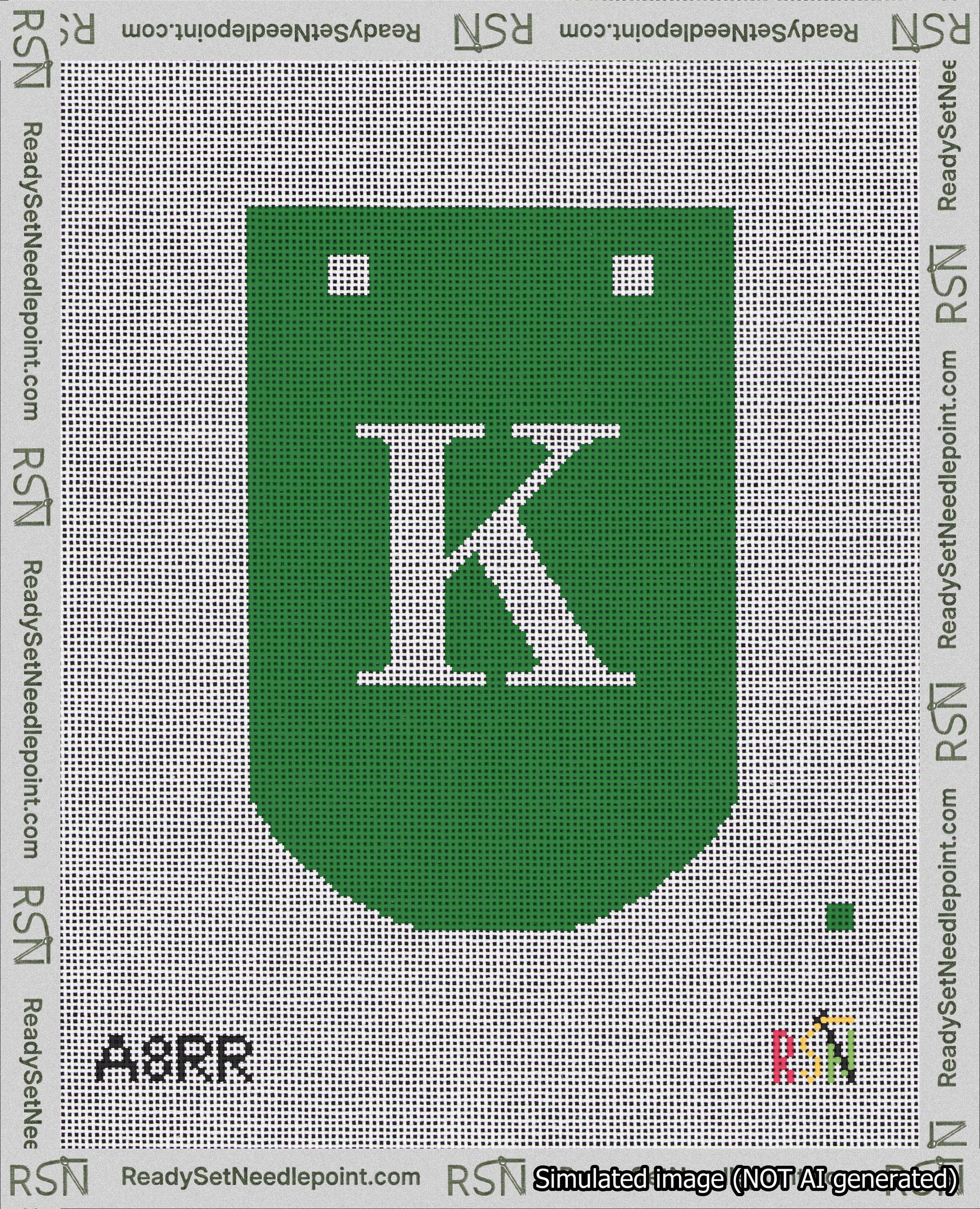 A taped needlepoint canvas with the design: Banner 18 mesh count Curved K White on Green.