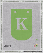 A taped needlepoint canvas with the design: Banner 18 mesh count Curved K White on Light Green.