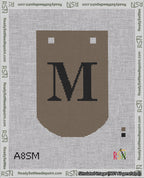 A taped needlepoint canvas with the design: Banner 18 mesh count Curved M Black on Brown.