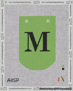 A taped needlepoint canvas with the design: Banner 18 mesh count Curved M Black on Light Green.