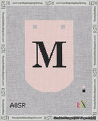 A taped needlepoint canvas with the design: Banner 18 mesh count Curved M Black on Pink.