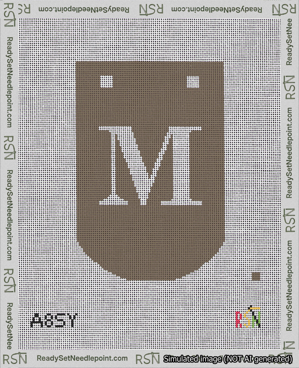 A taped needlepoint canvas with the design: Banner 18 mesh count Curved M White on Brown.
