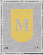 A taped needlepoint canvas with the design: Banner 18 mesh count Curved M White on Yellow.