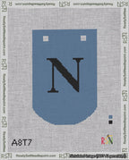 A taped needlepoint canvas with the design: Banner 18 mesh count Curved N Black on Blue.