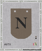 A taped needlepoint canvas with the design: Banner 18 mesh count Curved N Black on Brown.