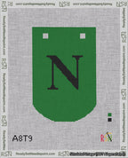 A taped needlepoint canvas with the design: Banner 18 mesh count Curved N Black on Green.