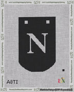 A taped needlepoint canvas with the design: Banner 18 mesh count Curved N White on Black.